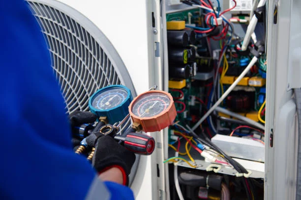 Pressure gauges used to check an outdoor HVAC system